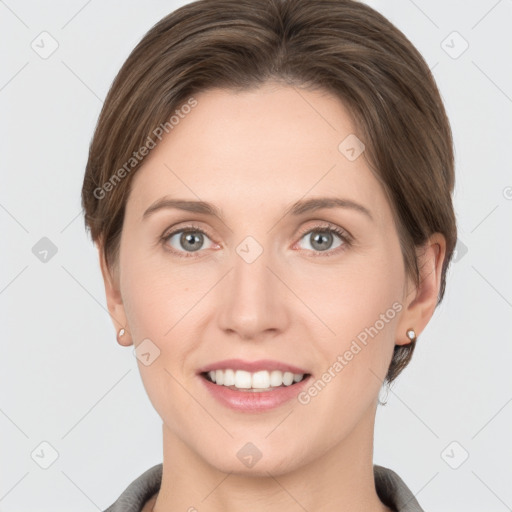 Joyful white young-adult female with short  brown hair and grey eyes