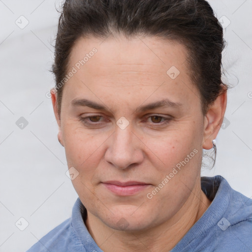 Joyful white adult female with short  brown hair and brown eyes