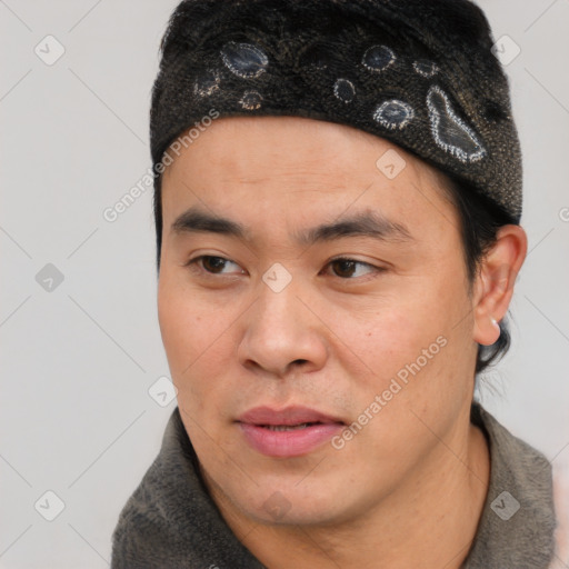 Joyful asian young-adult male with short  black hair and brown eyes