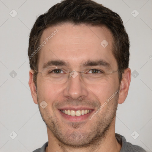 Joyful white adult male with short  brown hair and brown eyes