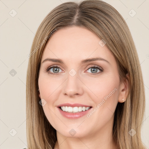 Joyful white young-adult female with long  brown hair and green eyes