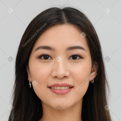 Joyful asian young-adult female with long  brown hair and brown eyes