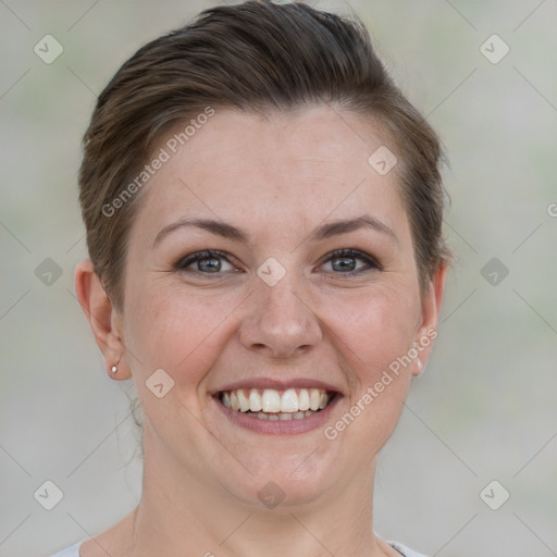 Joyful white adult female with short  brown hair and brown eyes