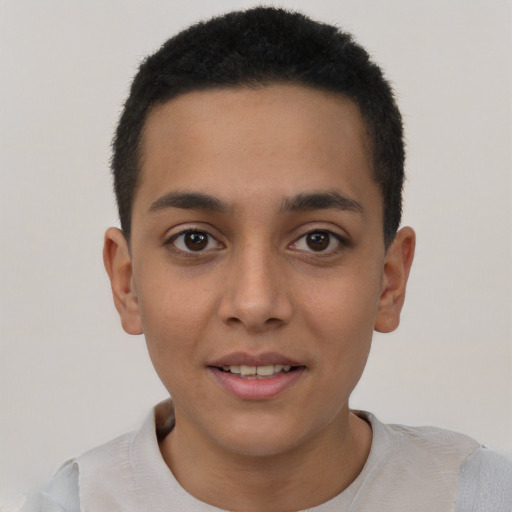 Joyful latino young-adult male with short  brown hair and brown eyes