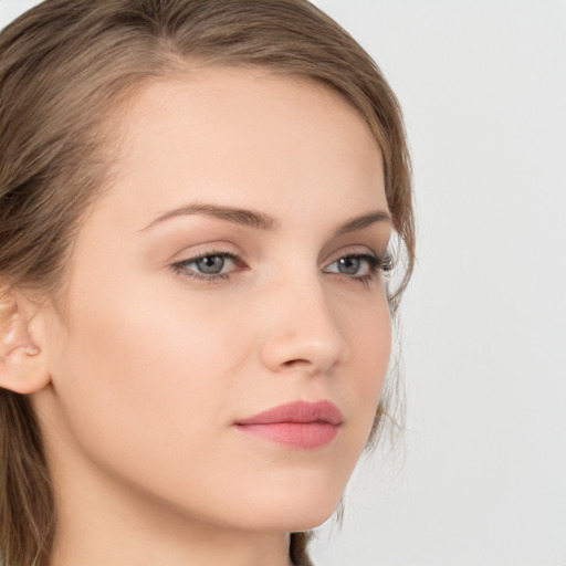 Neutral white young-adult female with long  brown hair and grey eyes