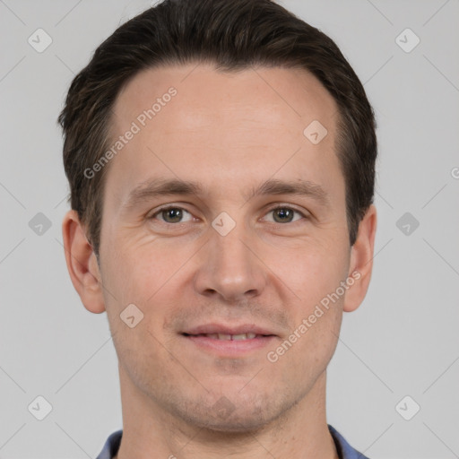 Joyful white adult male with short  brown hair and grey eyes