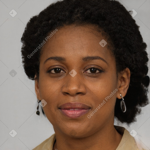 Joyful black adult female with short  brown hair and brown eyes