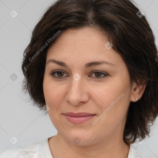 Joyful white adult female with medium  brown hair and brown eyes