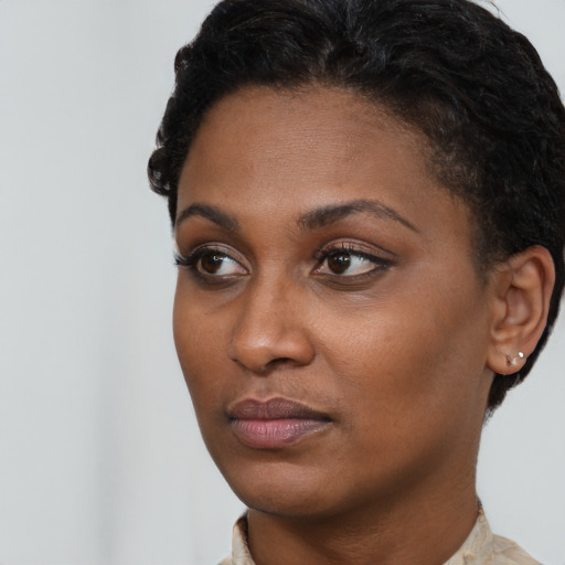 Neutral black young-adult female with short  brown hair and brown eyes