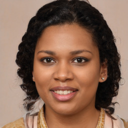 Joyful black young-adult female with medium  brown hair and brown eyes