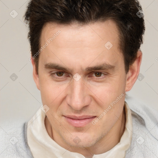 Joyful white adult male with short  brown hair and brown eyes