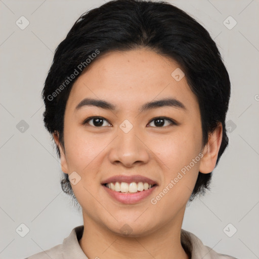 Joyful asian young-adult female with medium  black hair and brown eyes