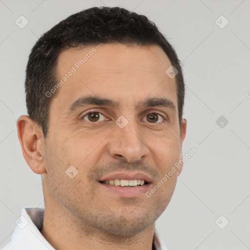 Joyful white adult male with short  brown hair and brown eyes