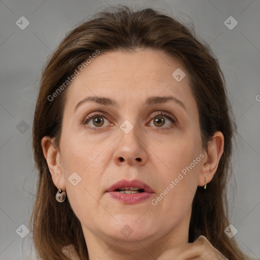 Joyful white adult female with medium  brown hair and brown eyes