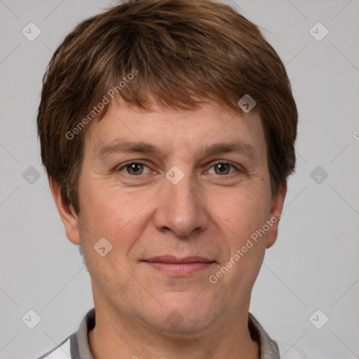 Joyful white adult male with short  brown hair and grey eyes