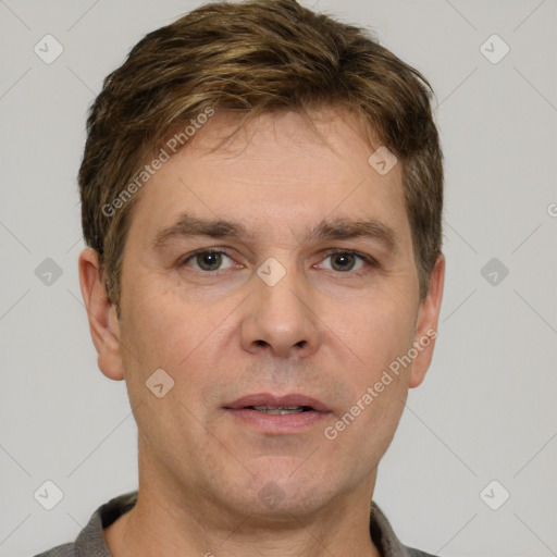 Neutral white adult male with short  brown hair and grey eyes