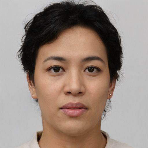 Joyful asian young-adult female with short  black hair and brown eyes