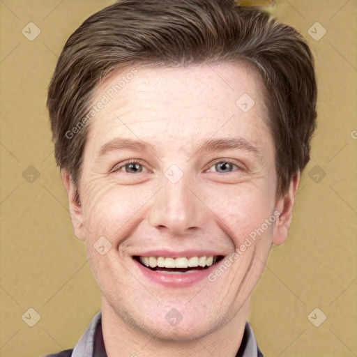 Joyful white adult male with short  brown hair and grey eyes