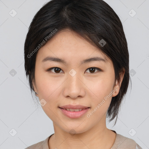 Joyful asian young-adult female with medium  brown hair and brown eyes