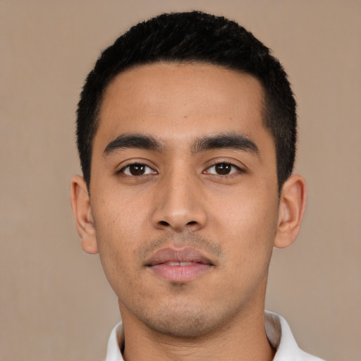 Neutral latino young-adult male with short  black hair and brown eyes