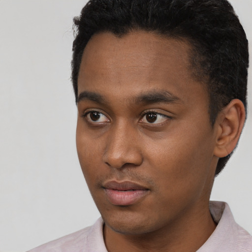 Neutral black young-adult male with short  black hair and brown eyes