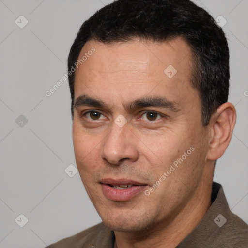 Joyful white adult male with short  black hair and brown eyes