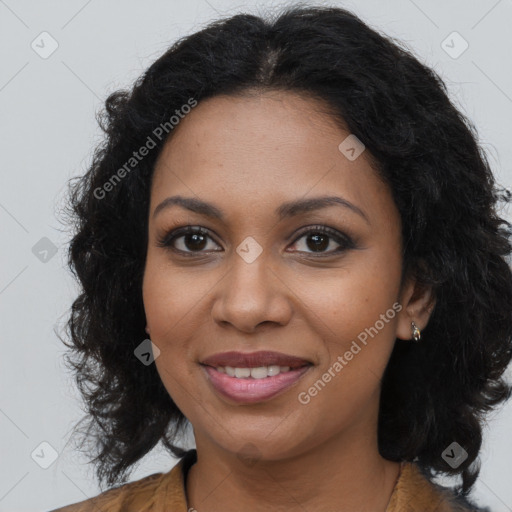 Joyful black young-adult female with long  brown hair and brown eyes