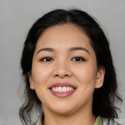 Joyful asian young-adult female with medium  black hair and brown eyes