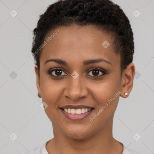 Joyful black young-adult female with short  brown hair and brown eyes