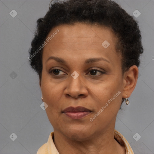 Joyful black adult female with short  brown hair and brown eyes