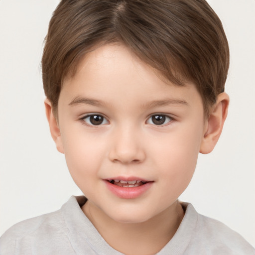 Joyful white child female with short  brown hair and brown eyes