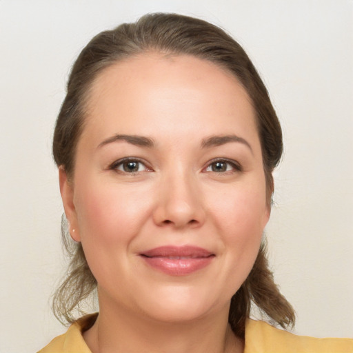 Joyful white young-adult female with medium  brown hair and brown eyes