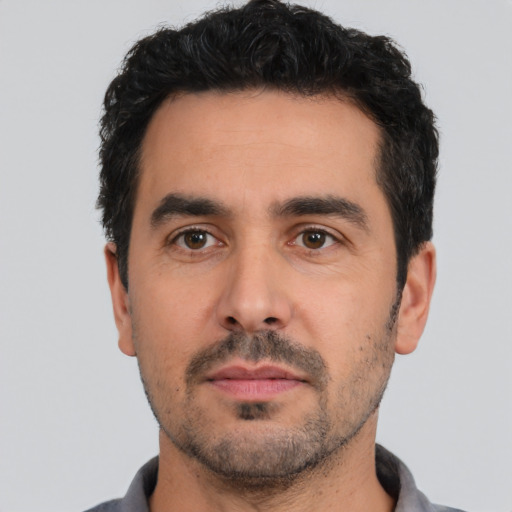 Neutral white young-adult male with short  black hair and brown eyes