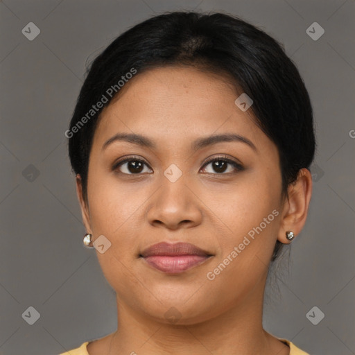 Joyful latino young-adult female with medium  brown hair and brown eyes