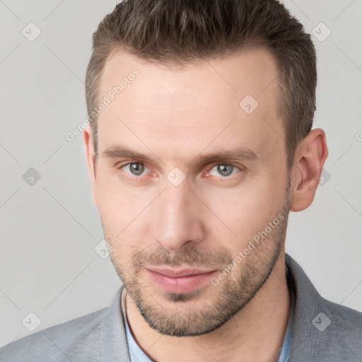 Neutral white young-adult male with short  brown hair and grey eyes