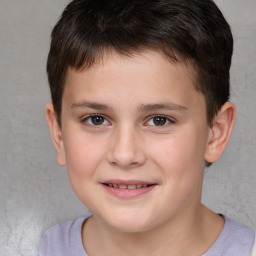 Joyful white child male with short  brown hair and brown eyes