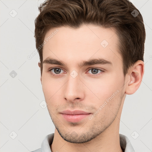 Neutral white young-adult male with short  brown hair and brown eyes