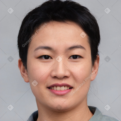 Joyful asian young-adult female with short  black hair and brown eyes