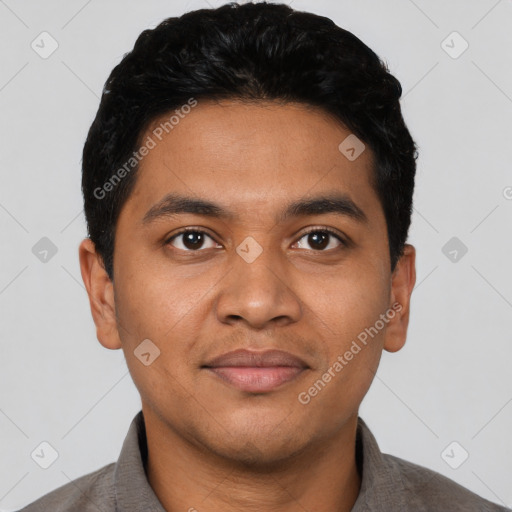 Joyful latino young-adult male with short  black hair and brown eyes