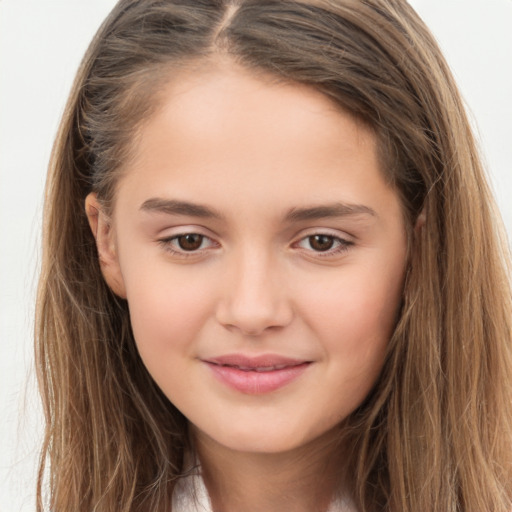 Joyful white child female with long  brown hair and brown eyes