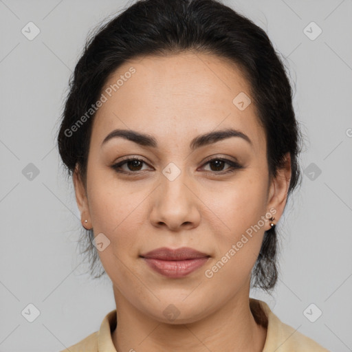 Joyful latino young-adult female with medium  brown hair and brown eyes