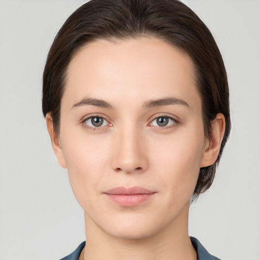 Neutral white young-adult female with short  brown hair and brown eyes