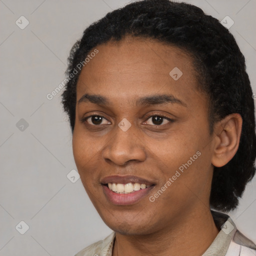 Joyful black young-adult female with short  black hair and brown eyes