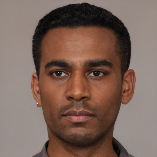 Neutral latino young-adult male with short  black hair and brown eyes