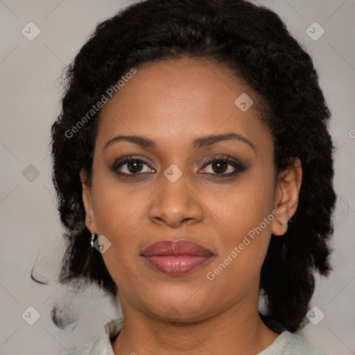 Joyful black adult female with medium  brown hair and brown eyes