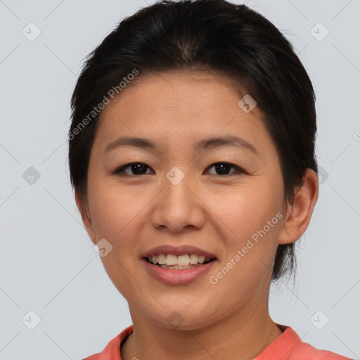 Joyful asian young-adult female with medium  brown hair and brown eyes