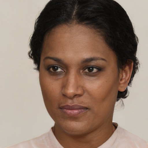Neutral black adult female with short  brown hair and brown eyes