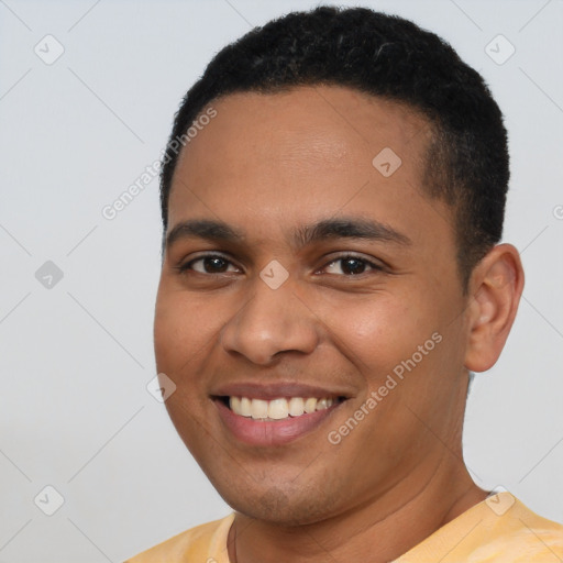 Joyful latino young-adult male with short  brown hair and brown eyes