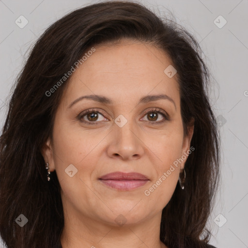 Joyful white adult female with long  brown hair and brown eyes