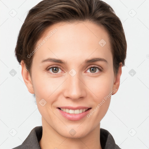 Joyful white young-adult female with short  brown hair and grey eyes